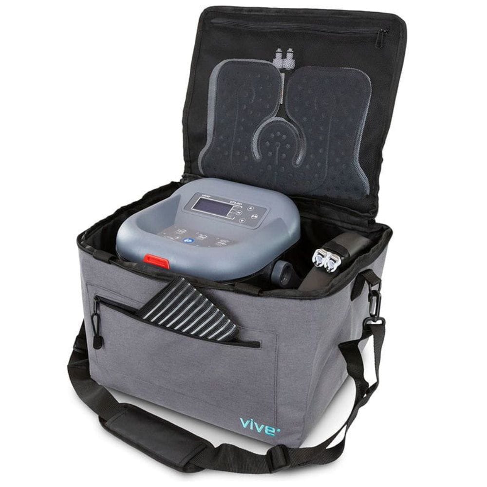 Gray and black medical device in a carrying case on a white background