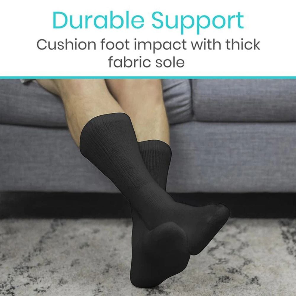 Person wearing black socks with text about durable support and thick fabric sole.