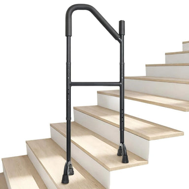 Black metal stair rail on a set of wooden stairs with a white background