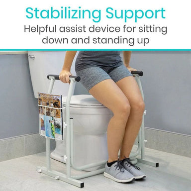 Person using a stabilizing support device while sitting on a toilet.