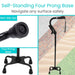 Black walking cane with four prong base and non-slip tips on a textured surface.
