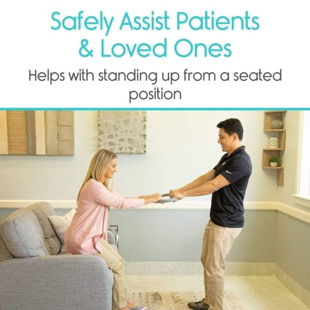 Person assisting another person to stand from a seated position in a living room setting.