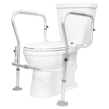 White toilet with a metal safety frame on a white background