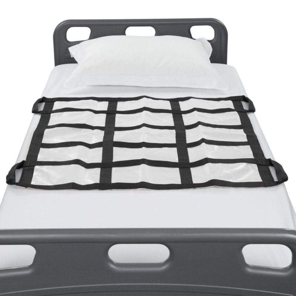 Grid-like cargo net on a truck bed with white bedding