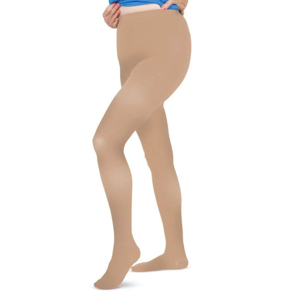 Beige tights worn by a person on a white background