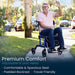 Man using a mobility scooter on a sidewalk with text about comfort features.
