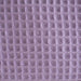 Close-up of a textured purple fabric with a waffle pattern