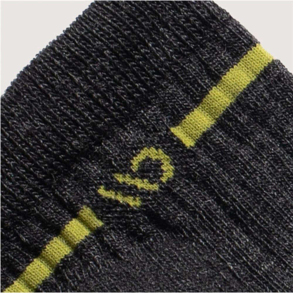 Close-up of a gray sock with yellow accents and a brand logo.
